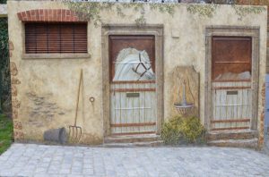 Sur-un-poste-edf-de-la-mairie-de-Viroflay-réalisation-et-création-Firmin-Biville-dun-décor-peint-mettant-en-scène-un-point-dhistoire-du-lieu-